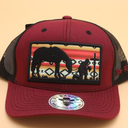 Cowboy Kneeling at Cross Trucker Hat